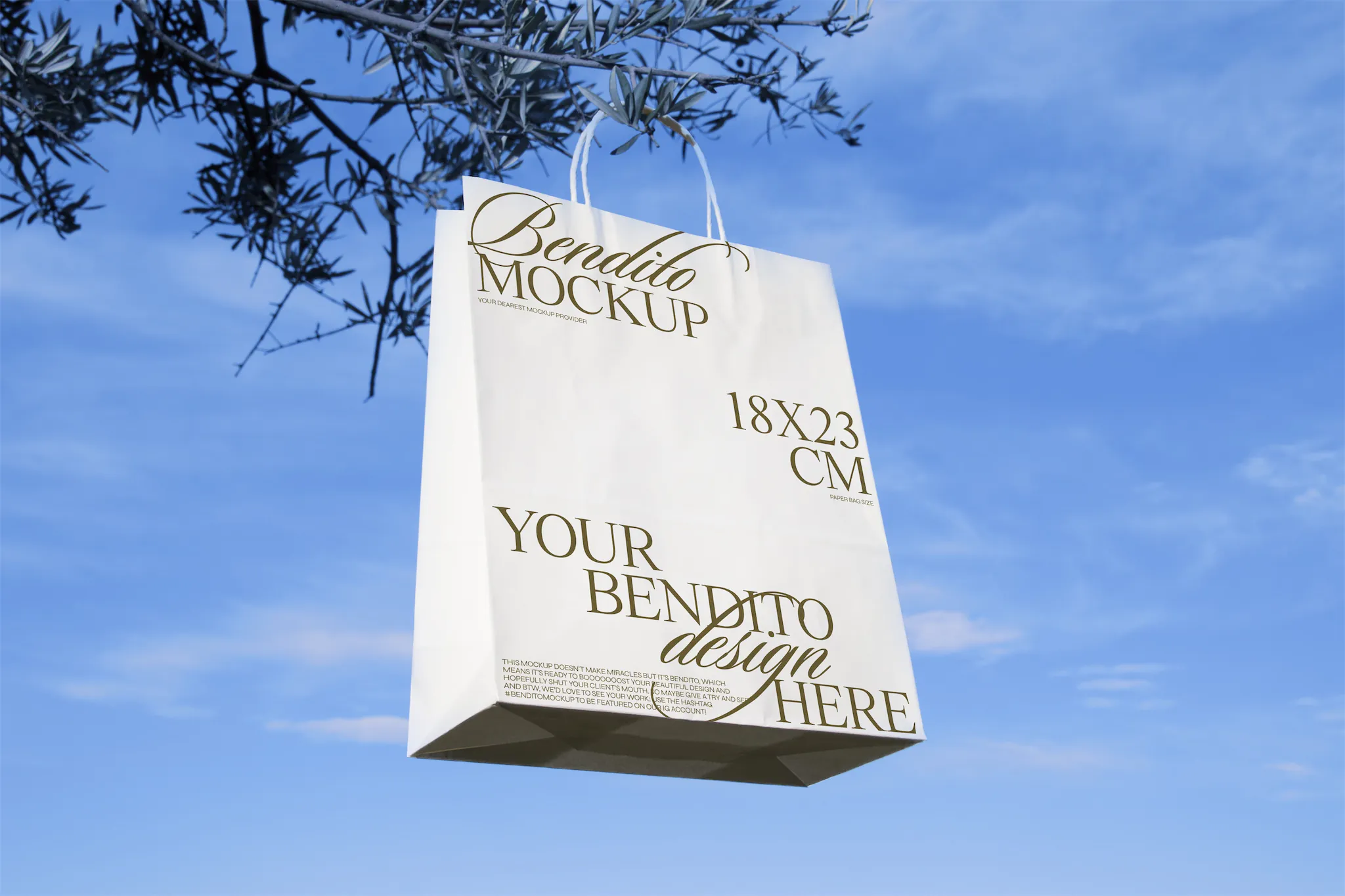Paper bag mockup hanging from the bench of a tree with sky background
