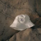 Bucket hat mock-up on top a rocky surface