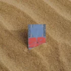 Business card mock-up stuck in the sand
