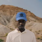 African-american man wearing a hat mock-up in a desert environment