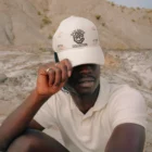 Black guy wearing a hat mock-up in a desert environment