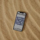 Iphone mock-up on a sandy surface