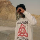 Black guy wearing a jumper mock-up in a desert environment