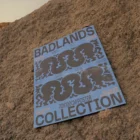 Poster mock-up on top of a little sandy mountain in a desert environment