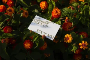 Business card mockup with orange flowers background.