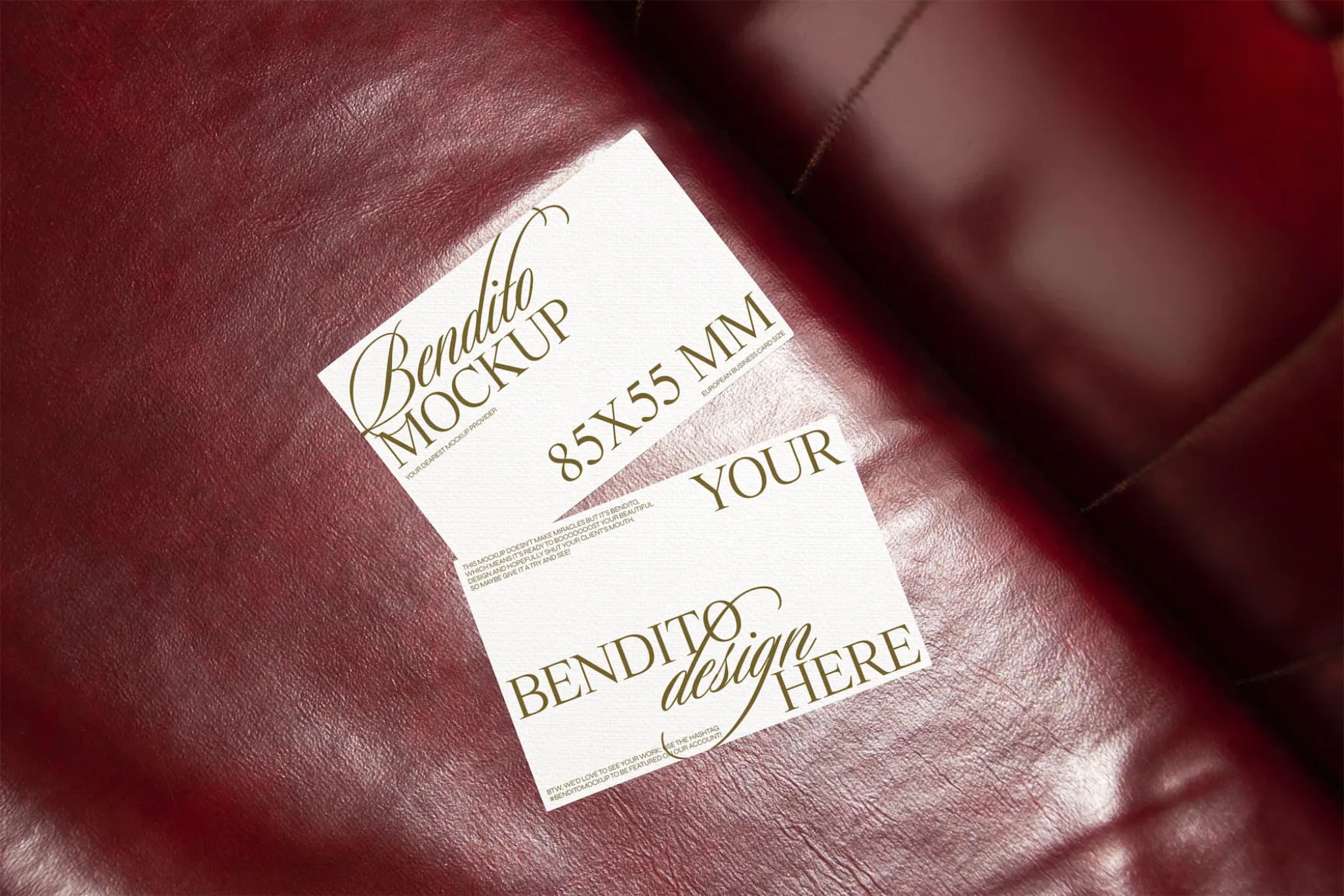 Front and back business card mockup on red leather couch with flash light.