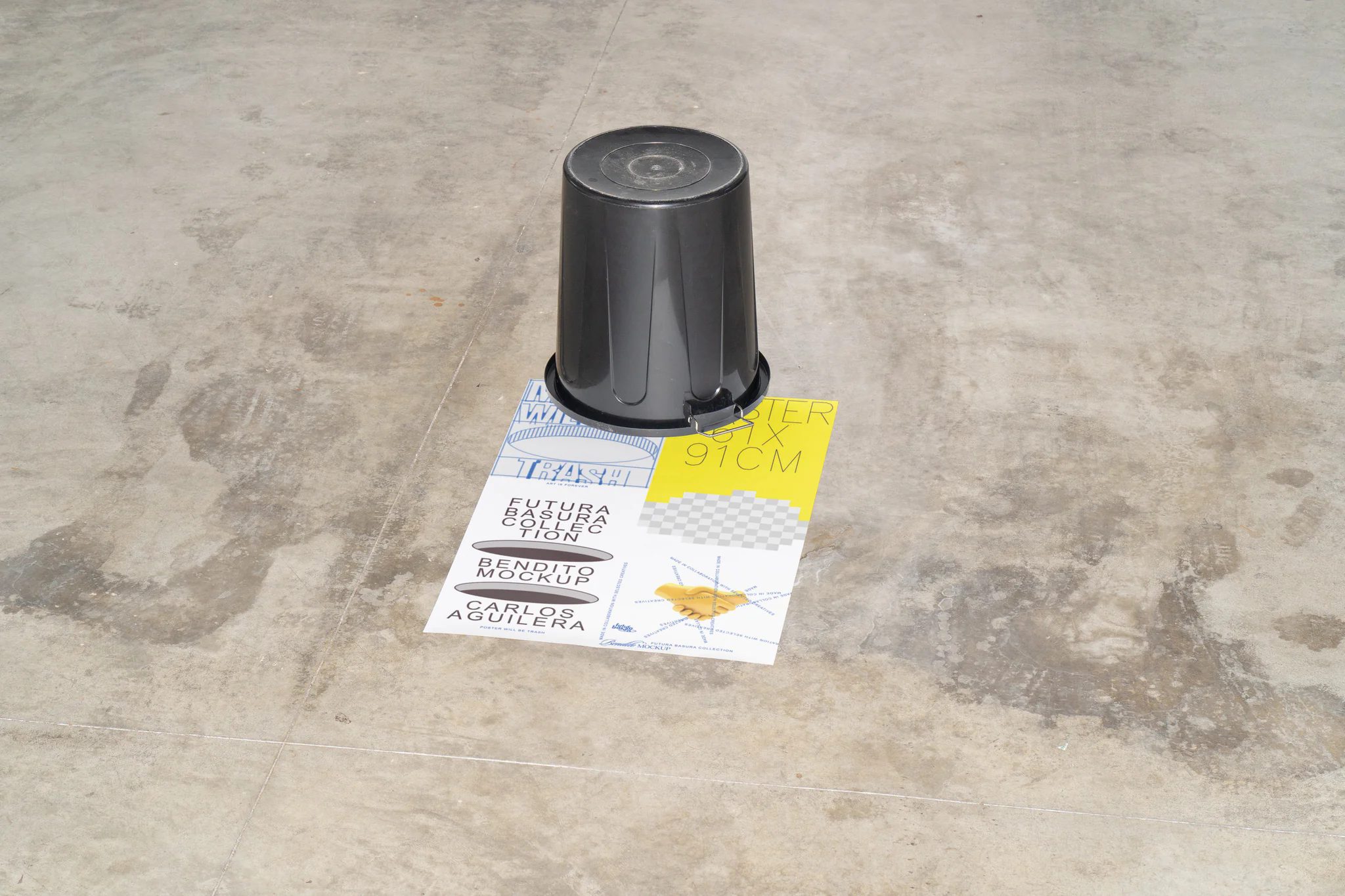 Poster mockup placed in the floor with a black plastic bin on top.