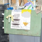 Poster mockup placed inside of a garbage bin.