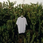 T-shirt mockup freebie in the middle of a bunch of cactus and vegetation.