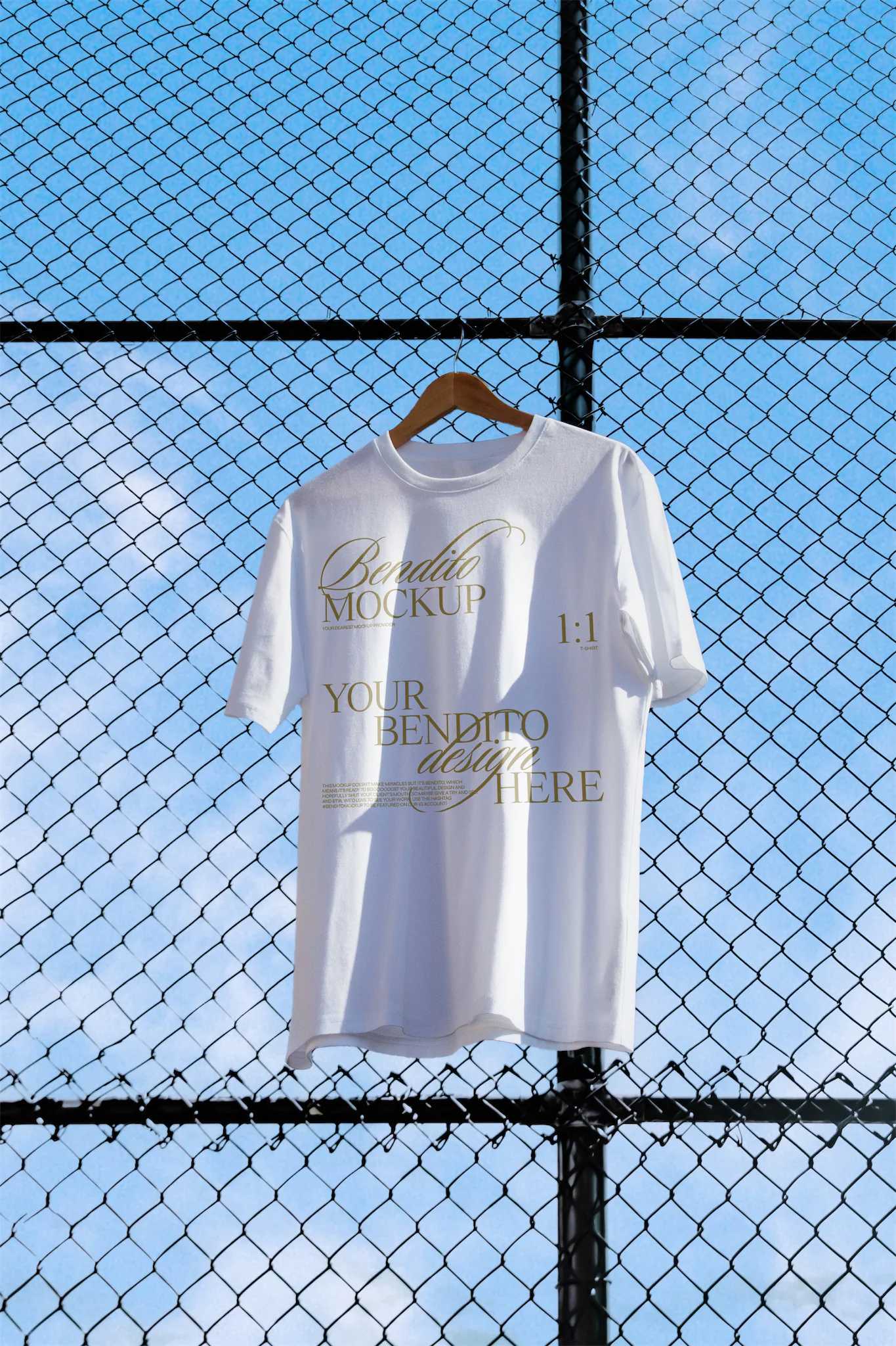 T-shirt mockup freebie with sky background with clouds.