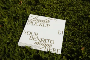 Vinyl mockup freebie photographed under natural light and placed over the green grass.