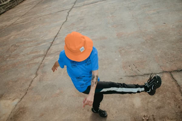 Bucket hat mockup worn by a female model in a urban scenario.