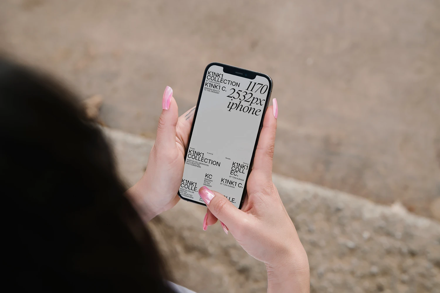 iPhone mockup in the hands of a girl with painted nails.