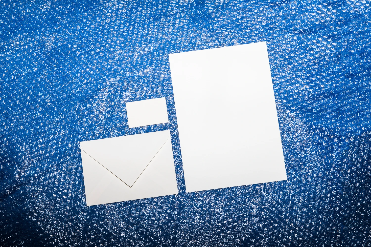 Stationery mockup placed over bubble wrap film.