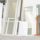 Poster mockup in front of different glass tall windows and glass tall doors
