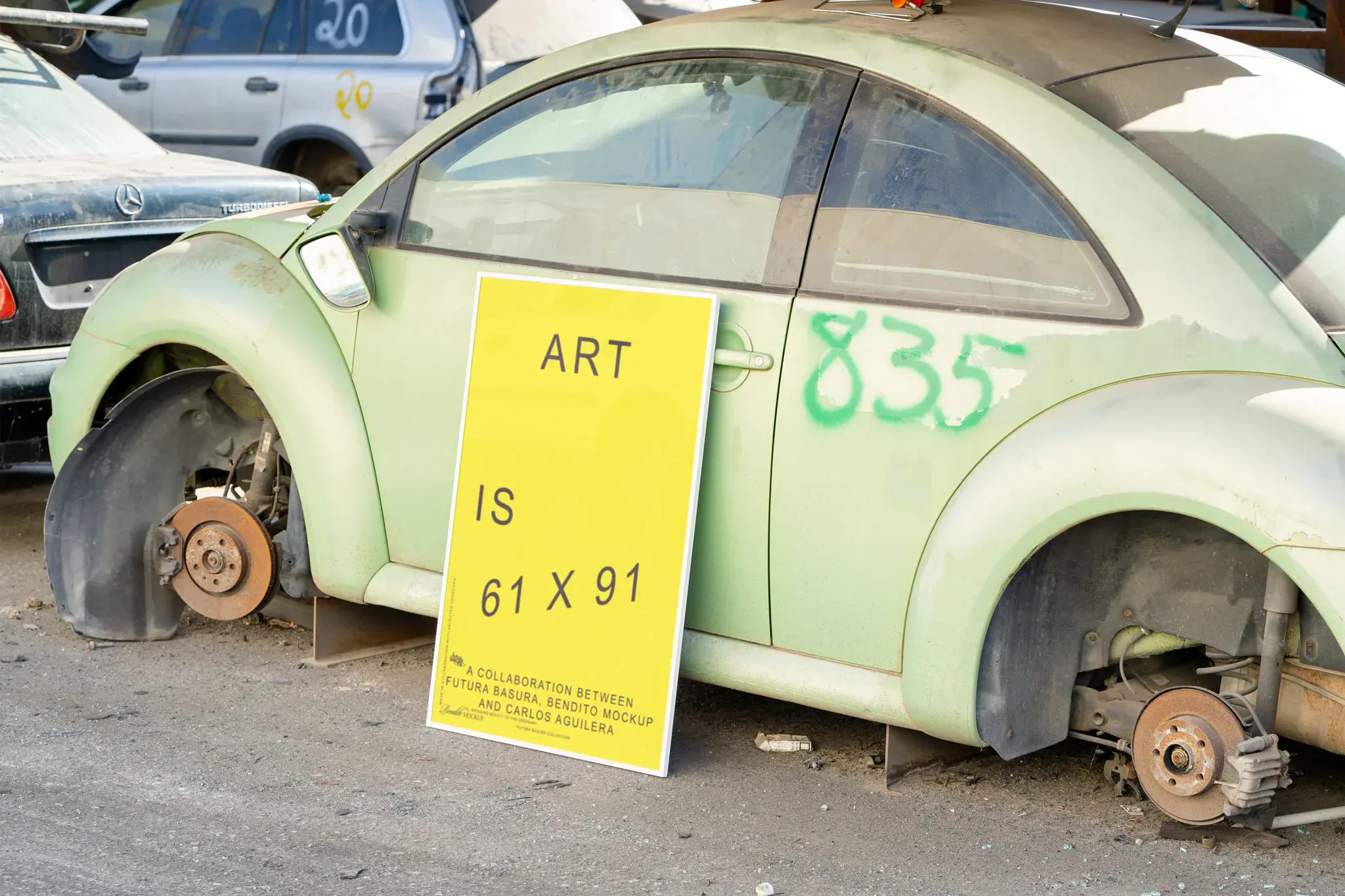 Framed poster mockup next to a green beetle car in a car scrapping
