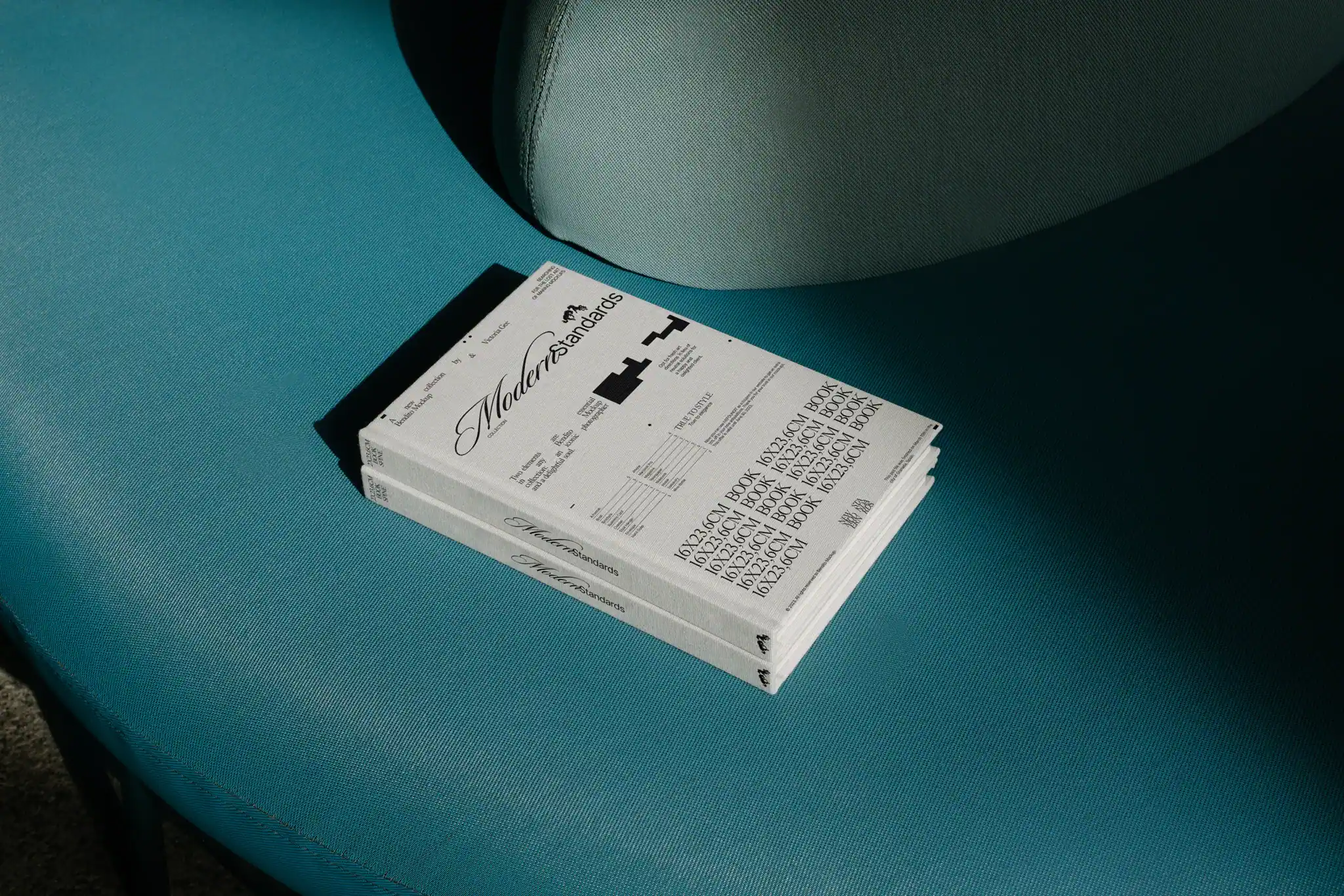 Book mockup on top of a green couch