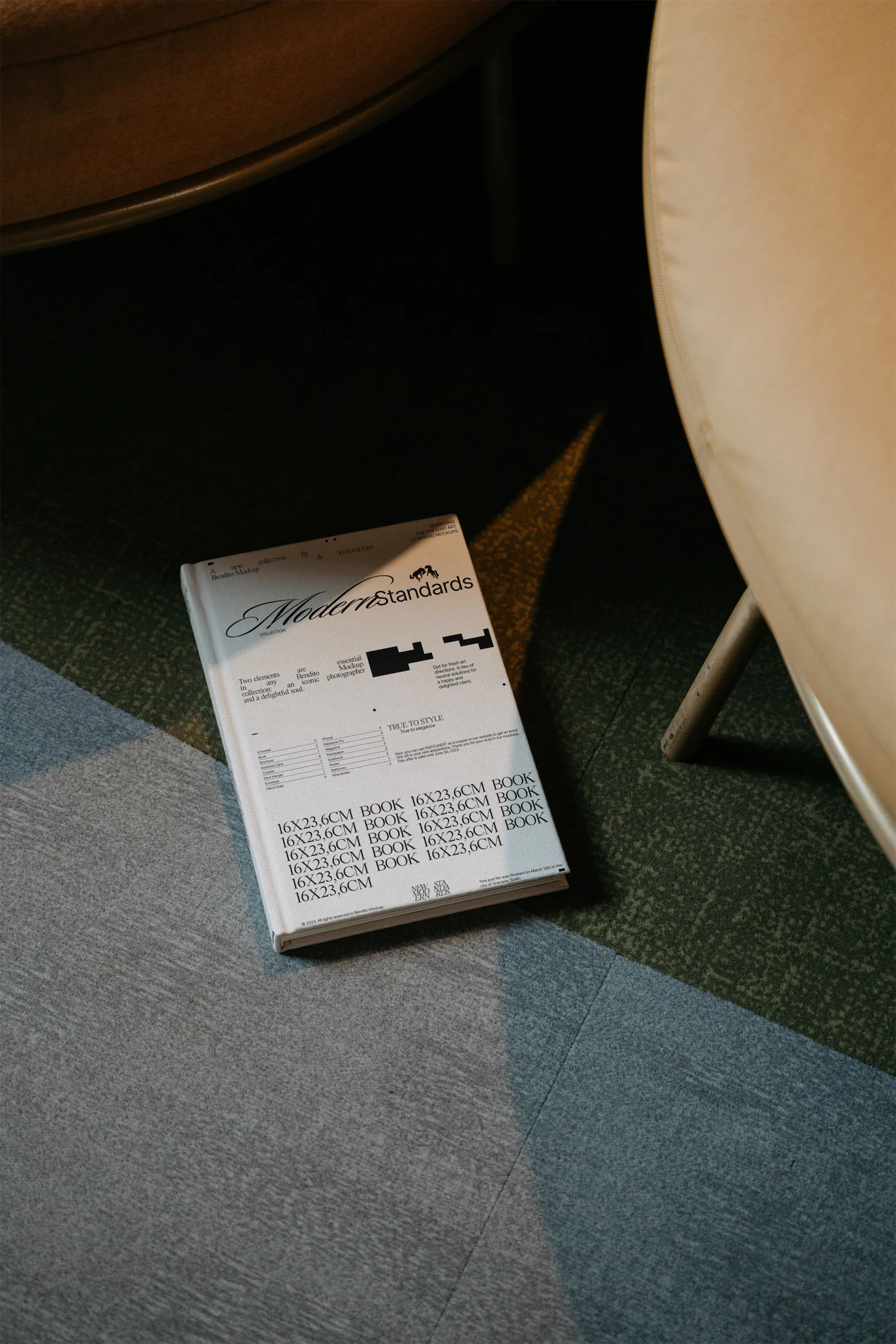 Book mockup over an elegant rug with round shadows