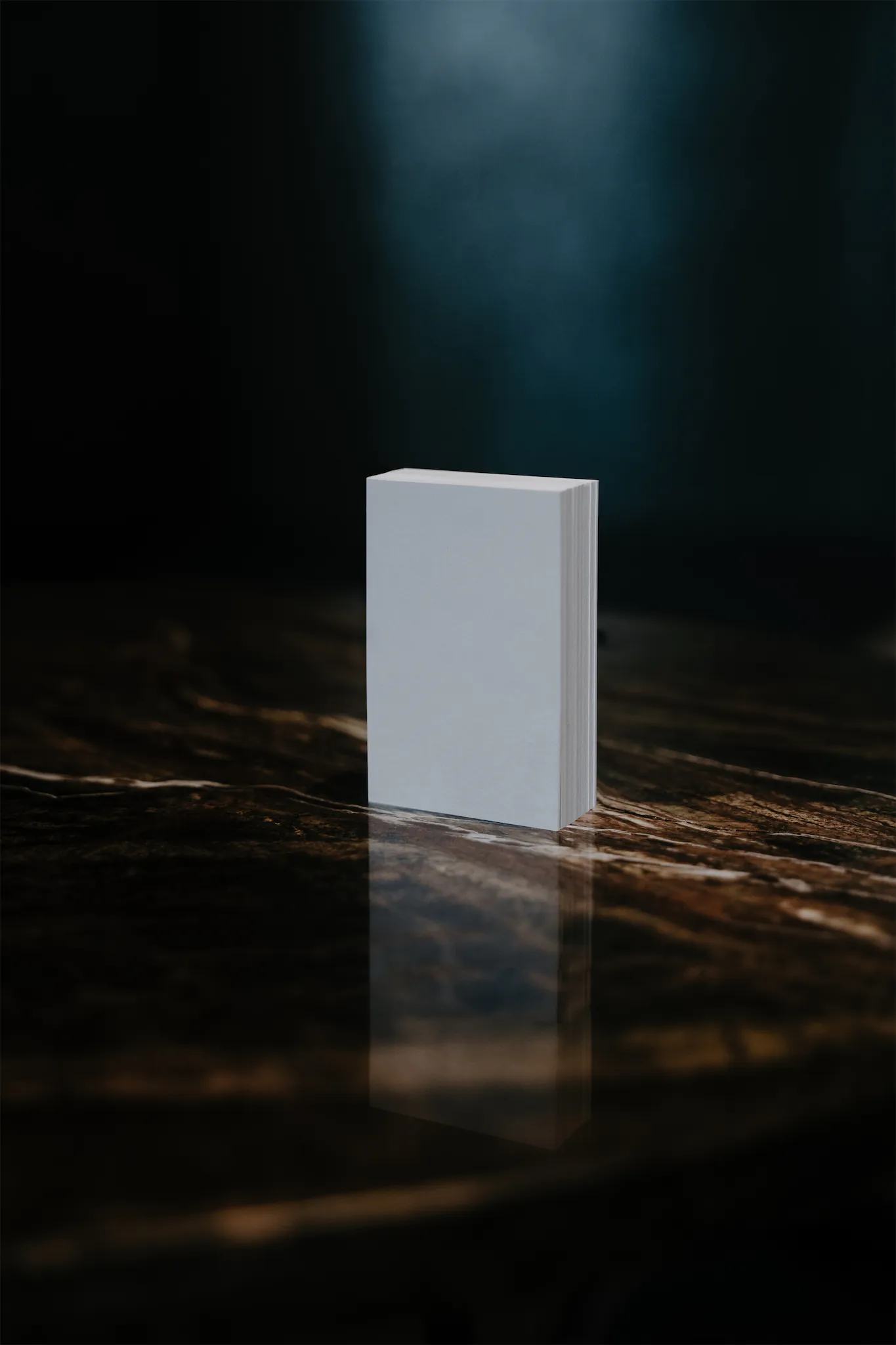 Block of business cards mockup on top of a dark and elegant marble table