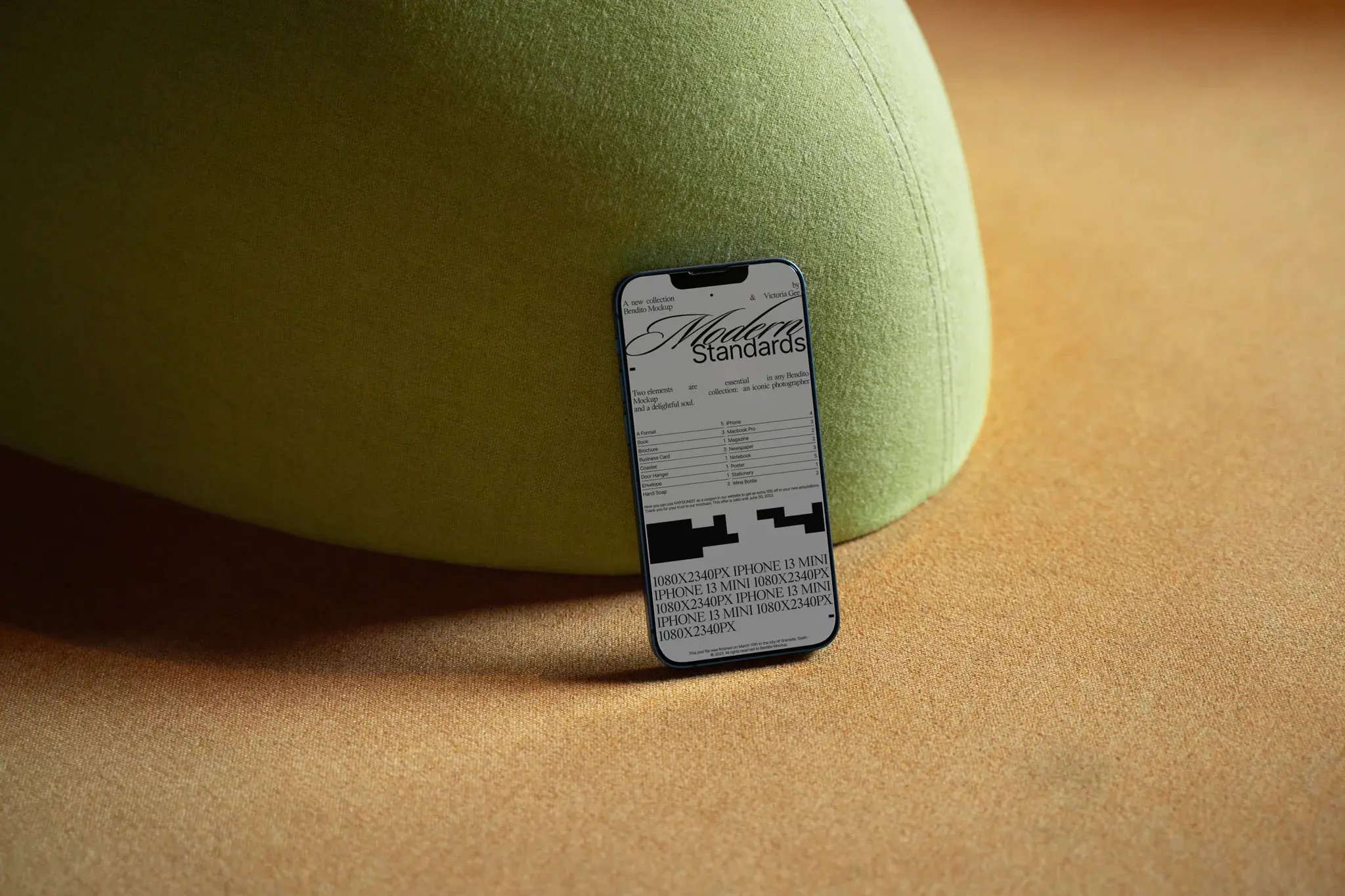 Iphone mockup on top of an orange couch