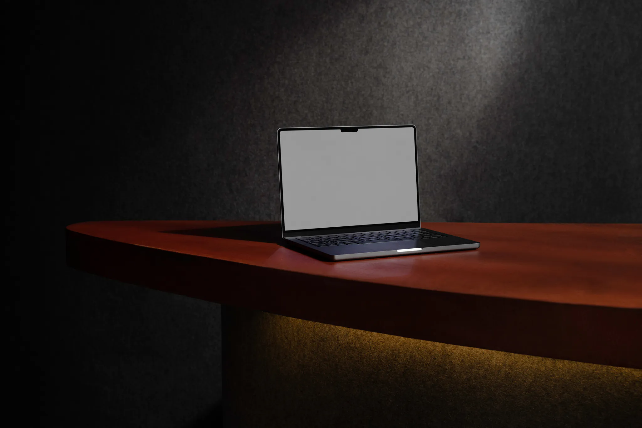 Macbook Pro mockup on top of a red counter in a intriguing environment