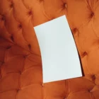 A Format mockup over a fancy orange couch