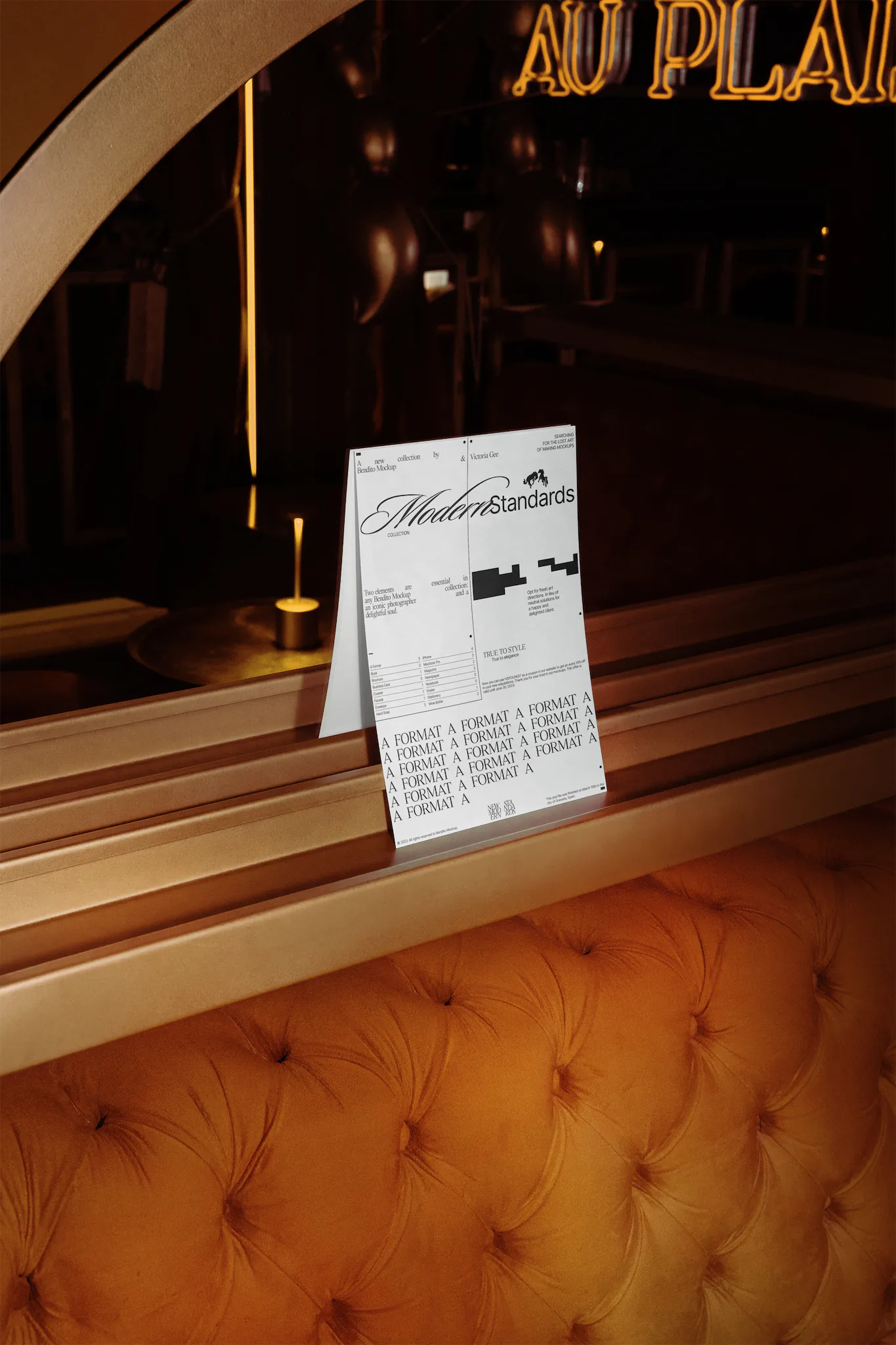 A Format mockup on top of an orange couch in a fancy bar environment