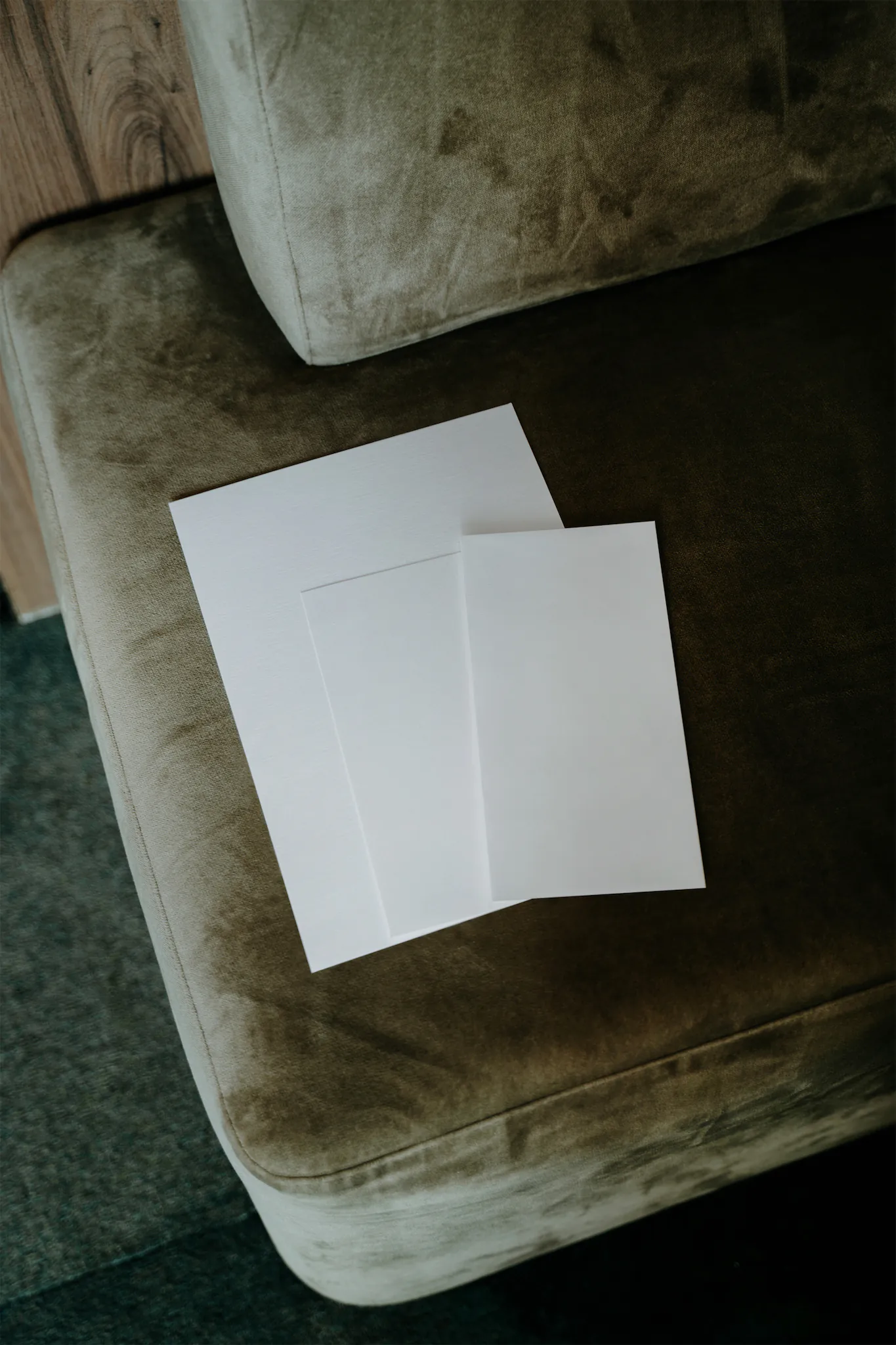 Set of stationery mockup over a fancy green sofa