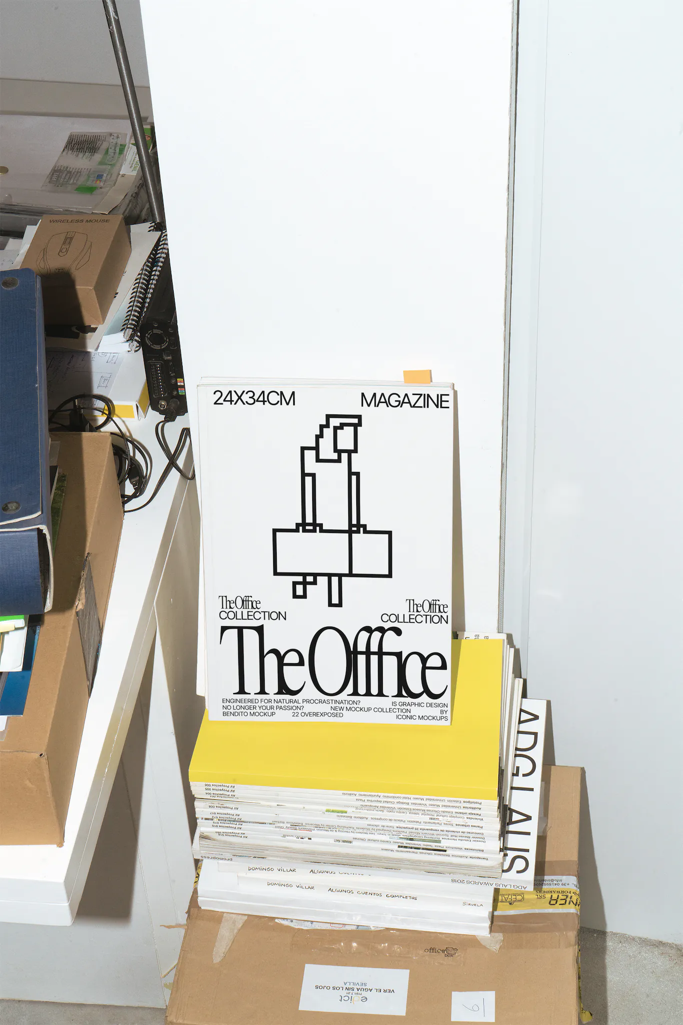 Magazine cover mockup on top of books in a office scene