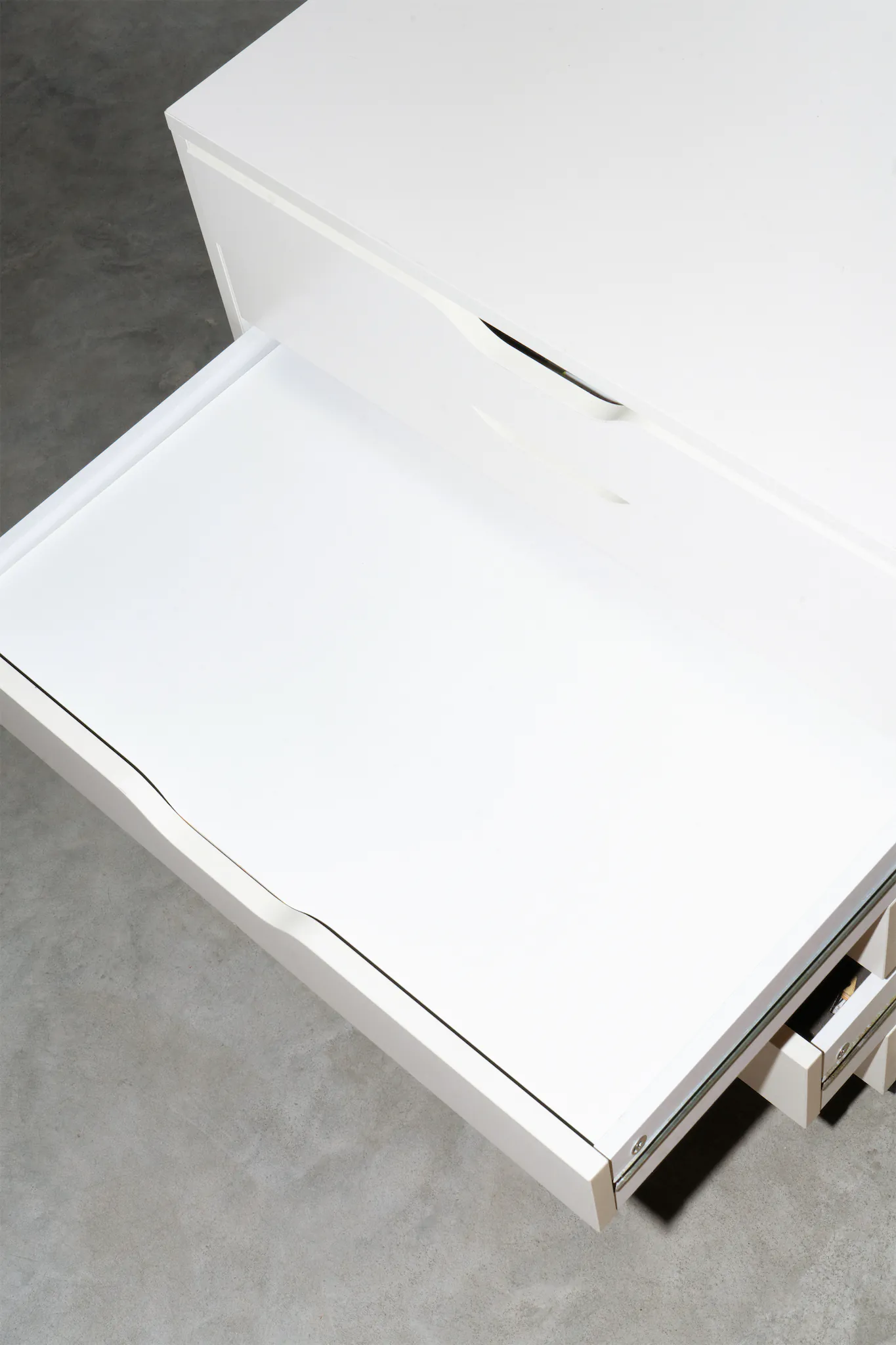 A-Format poster mockup inside a white chest of drawers