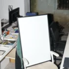 Framed mockup on top of chair in an office