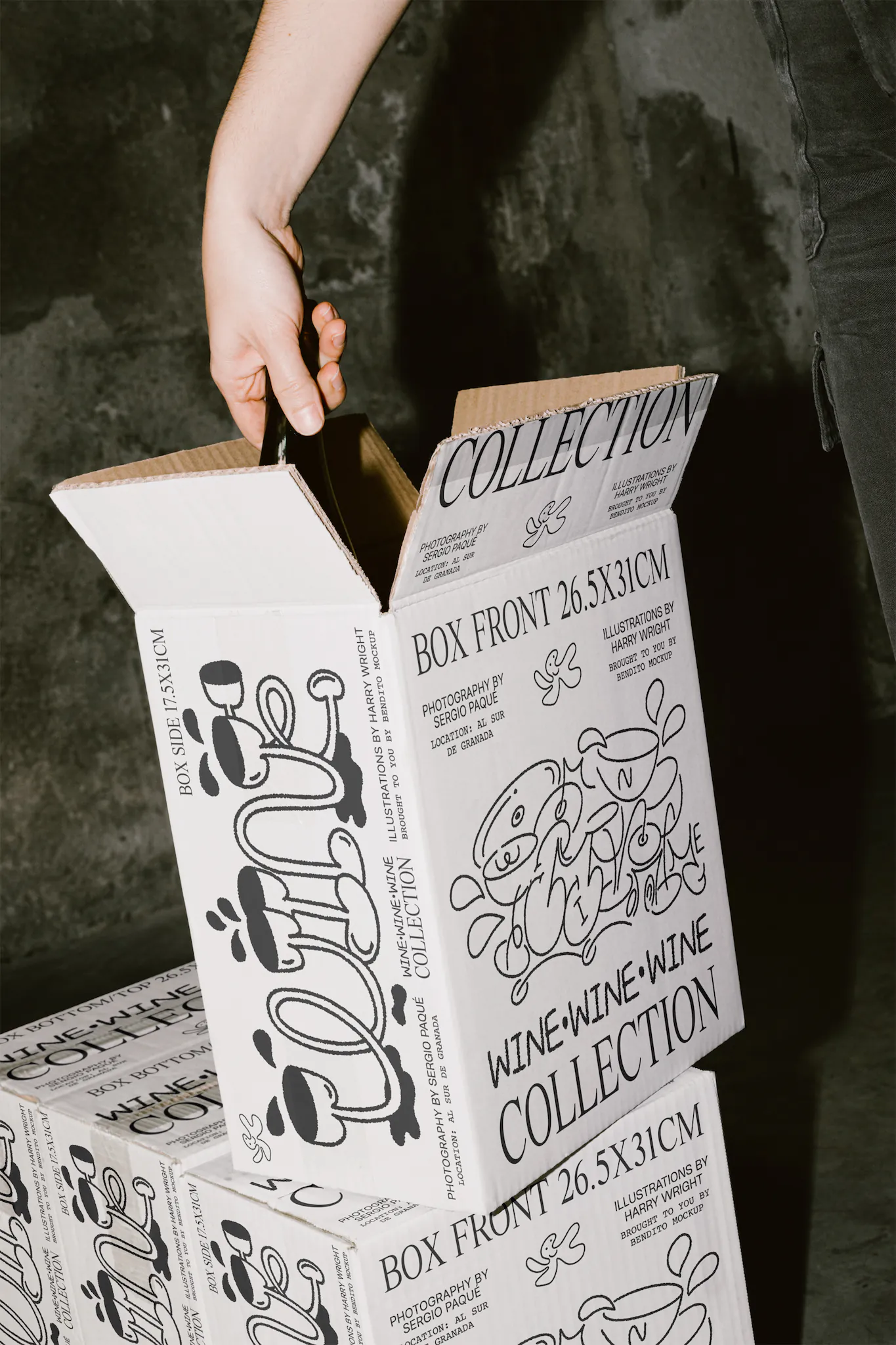 White cardboard box PSD mockup. A hand is pulling out of the box a wine bottle mockup. Wine packaging mockup. Wine shop mockup. Restaurant mockup.