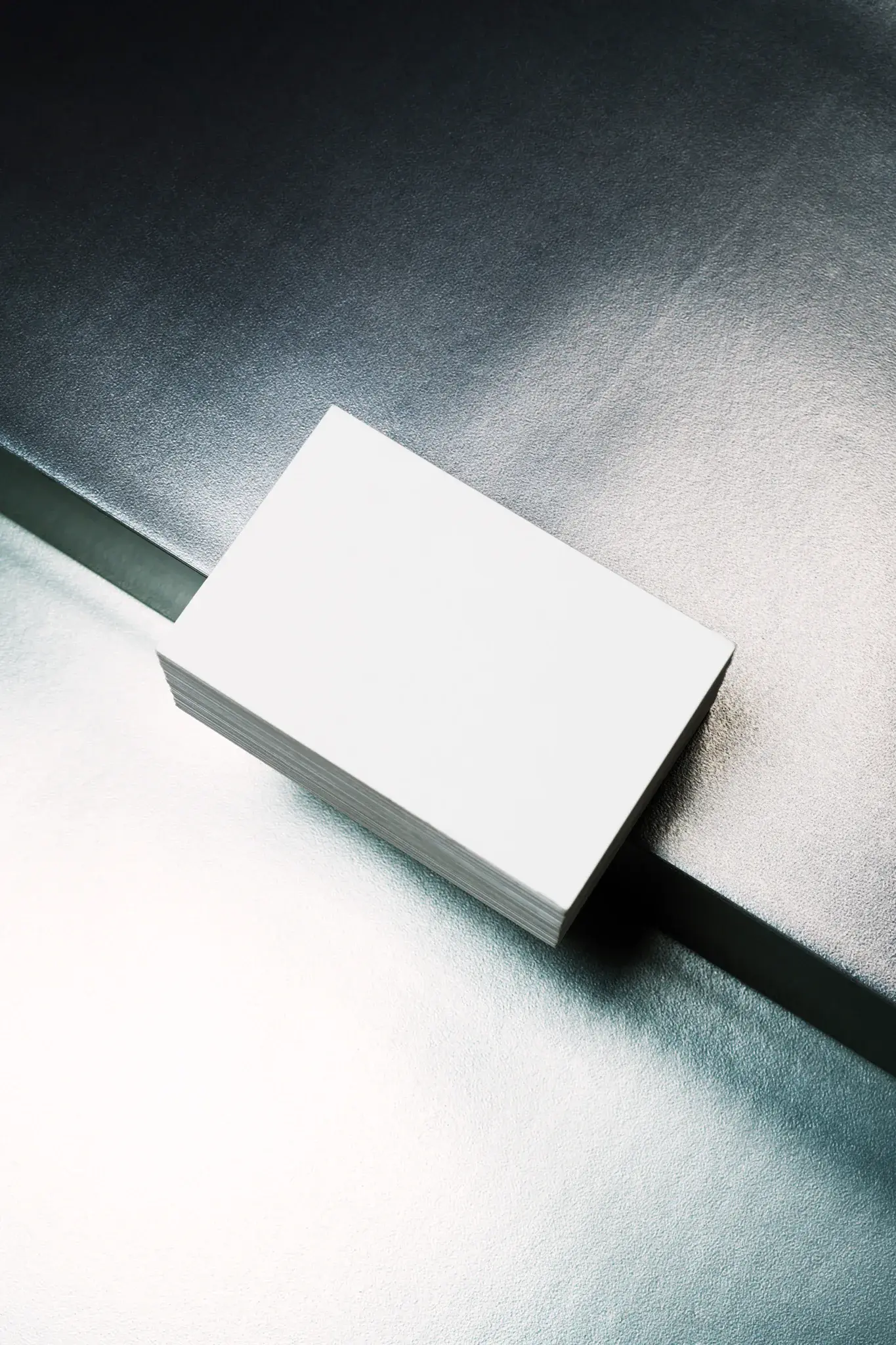 Business card mockup. Block of business cards placed on a metal surface. Branding mockup.