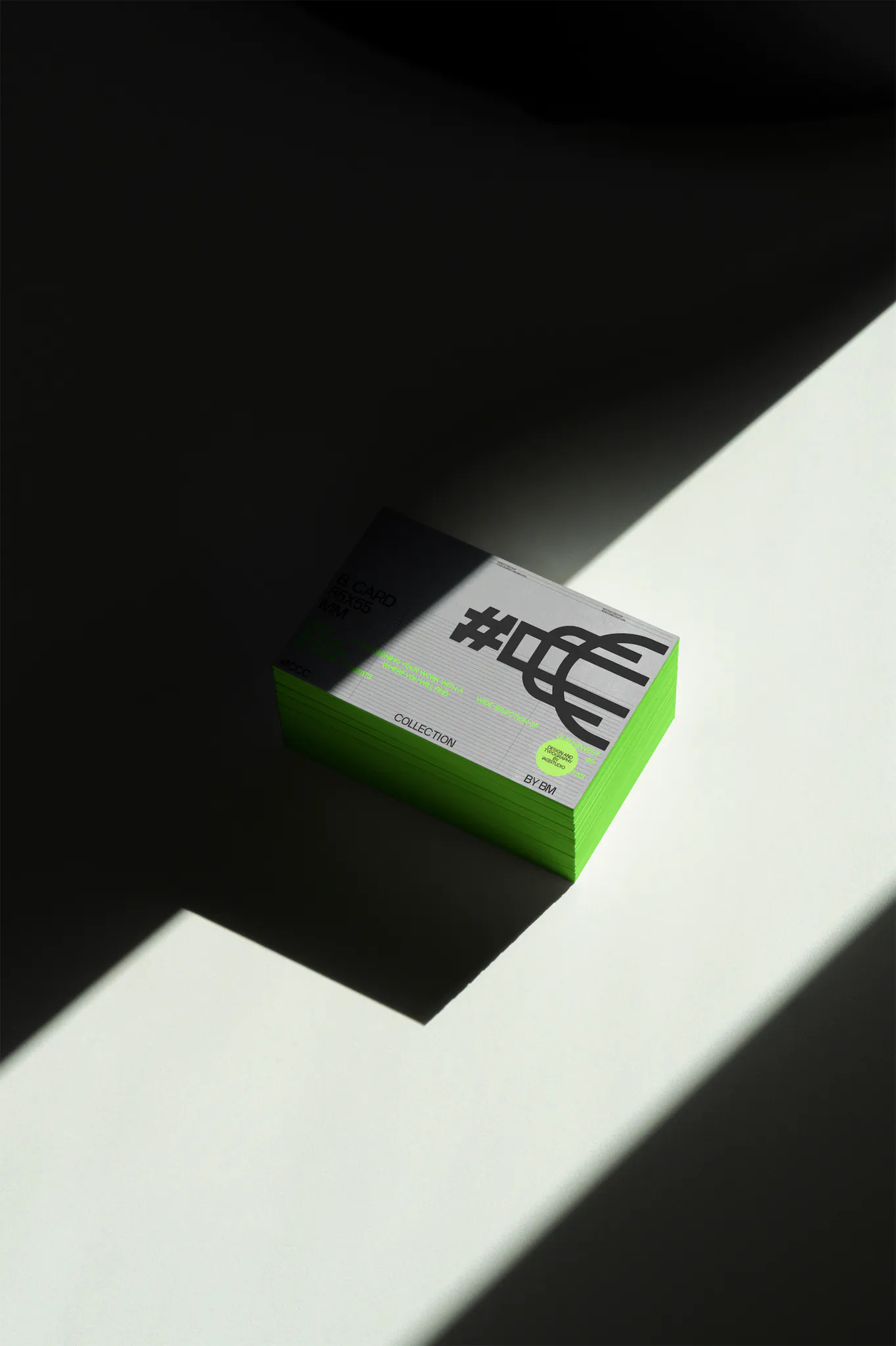 Business card format mockup on top of a white table in a real lights and shadows scene.