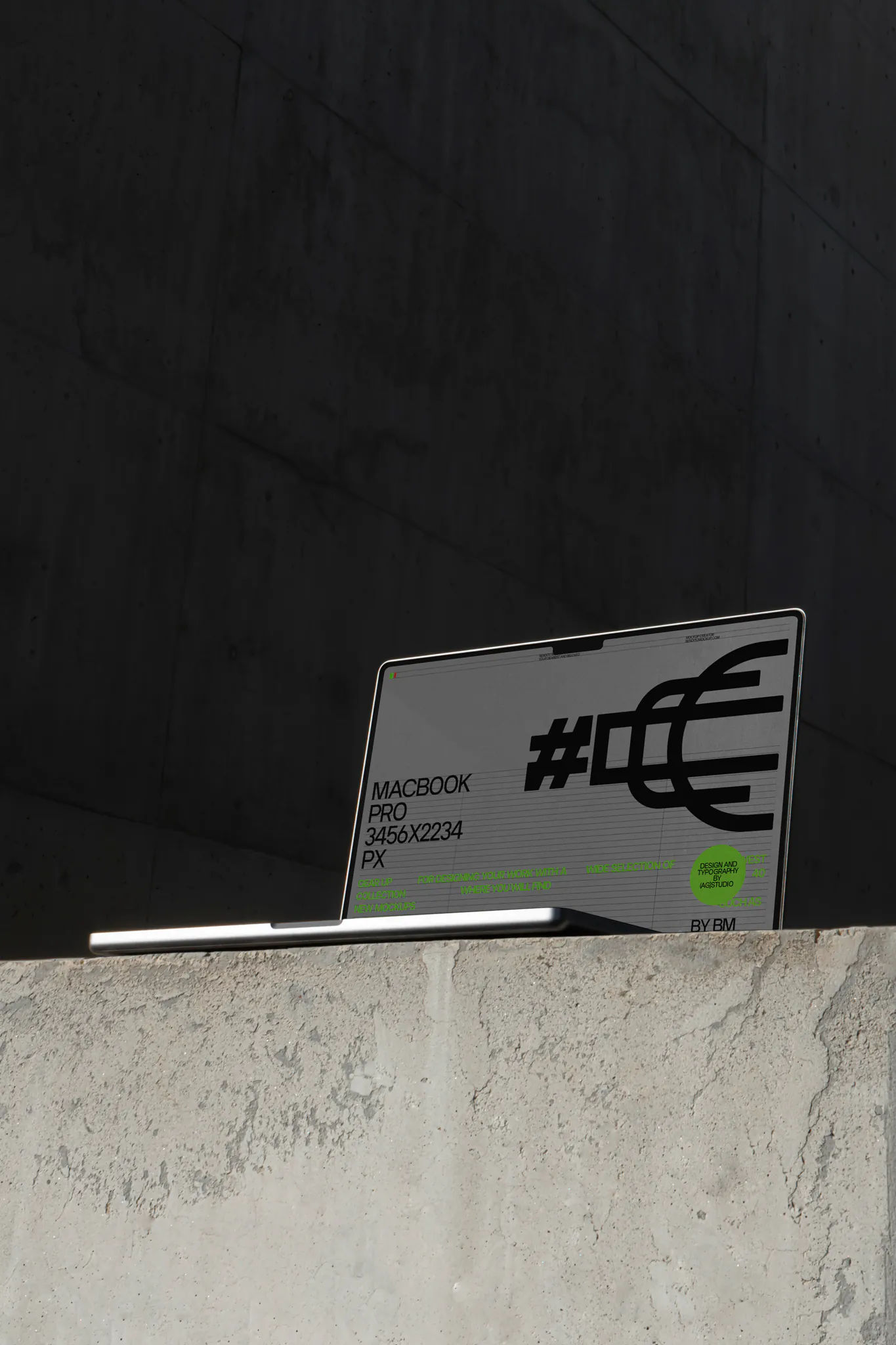 Macbook PSD mockup on top of a concrete surface in a concrete scene. Tech mockup.