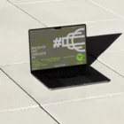 Macbook Pro PSD mockup on top of a floor of concrete slabs with real lights and shadows. Tech mockup.