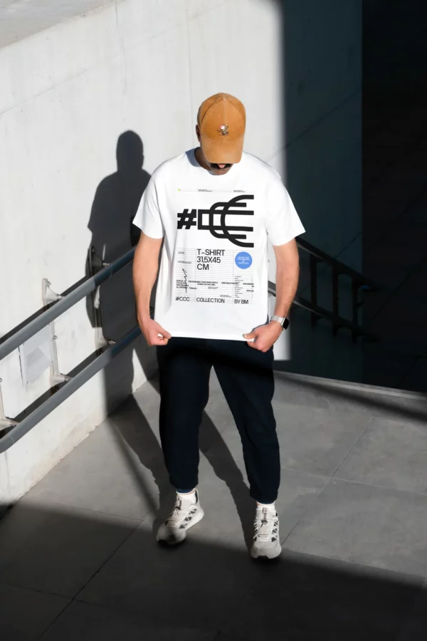 T-Shirt mockup. Man wearing a t-shirt mockup in a concrete scene with real lights and shadows. Fashion and apparel mockup.