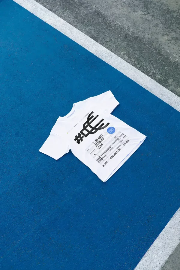 T-Shirt PSD mockup. T-shirt on top of the the floor of a blue baskeball court. Street mockup. Fashion and apparel mockup.