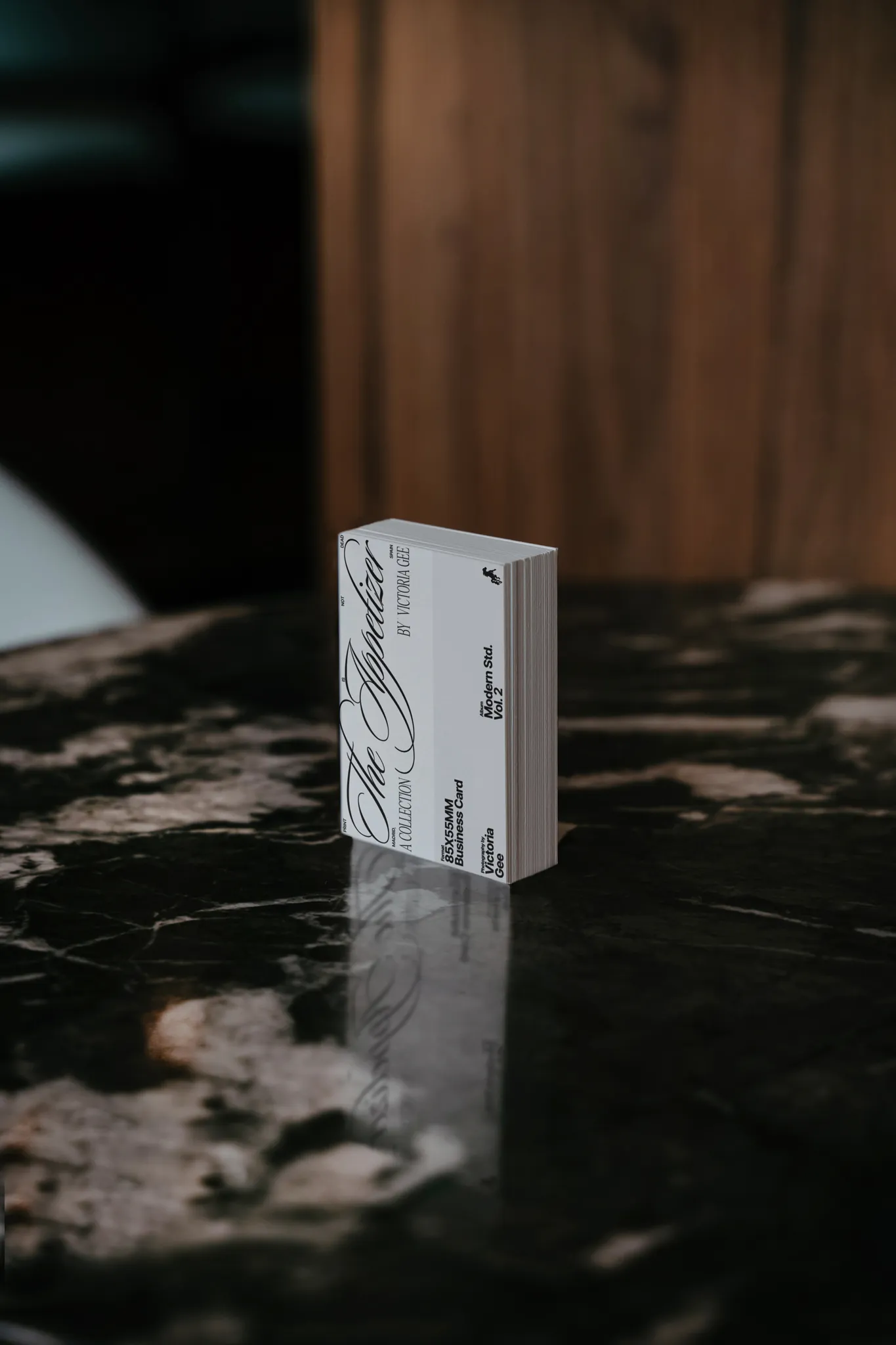 PSD mockup of a block of business cards on top of a fancy marble table. Branding mockup.