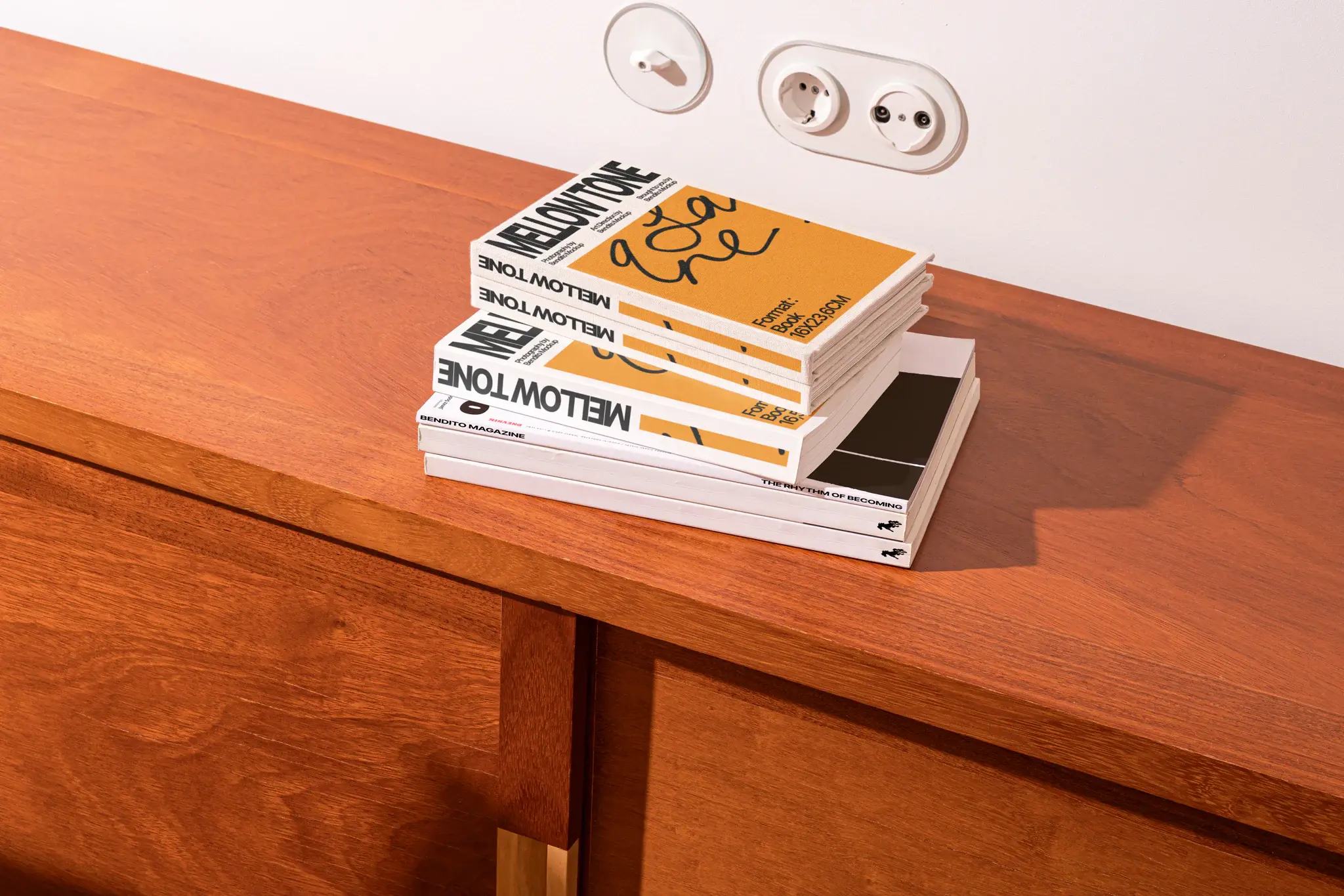 Pile of books mockup resting on a fancy wooden cabinet. Elegant book mockup for premium quality presentation. Hard cover book mockup in dream apartment, home interior design.