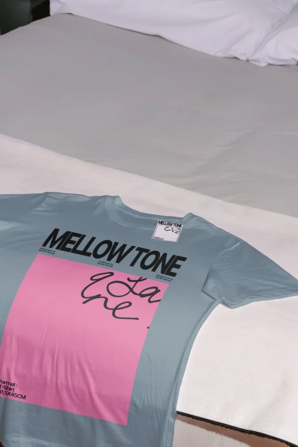 High-quality t-shirt mockup laying on a bed with white sheets. High-quality short sleeve t-shirt mockup resting on top of a blank. PSD mockup file of a white t-shirt, in a beautiful hotel with elegant and sophisticated furniture.