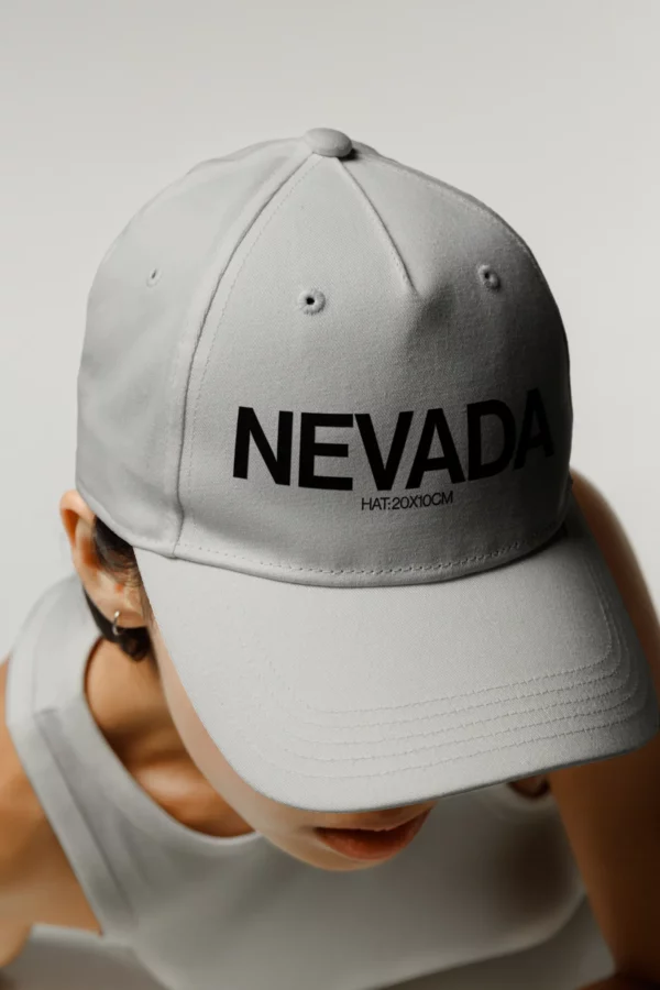 Woman wearing a white hat mockup and white tank top mockup, apparel mockup, hat mockup, fashion mockup, clothing mockup, premium quality hat mockup.