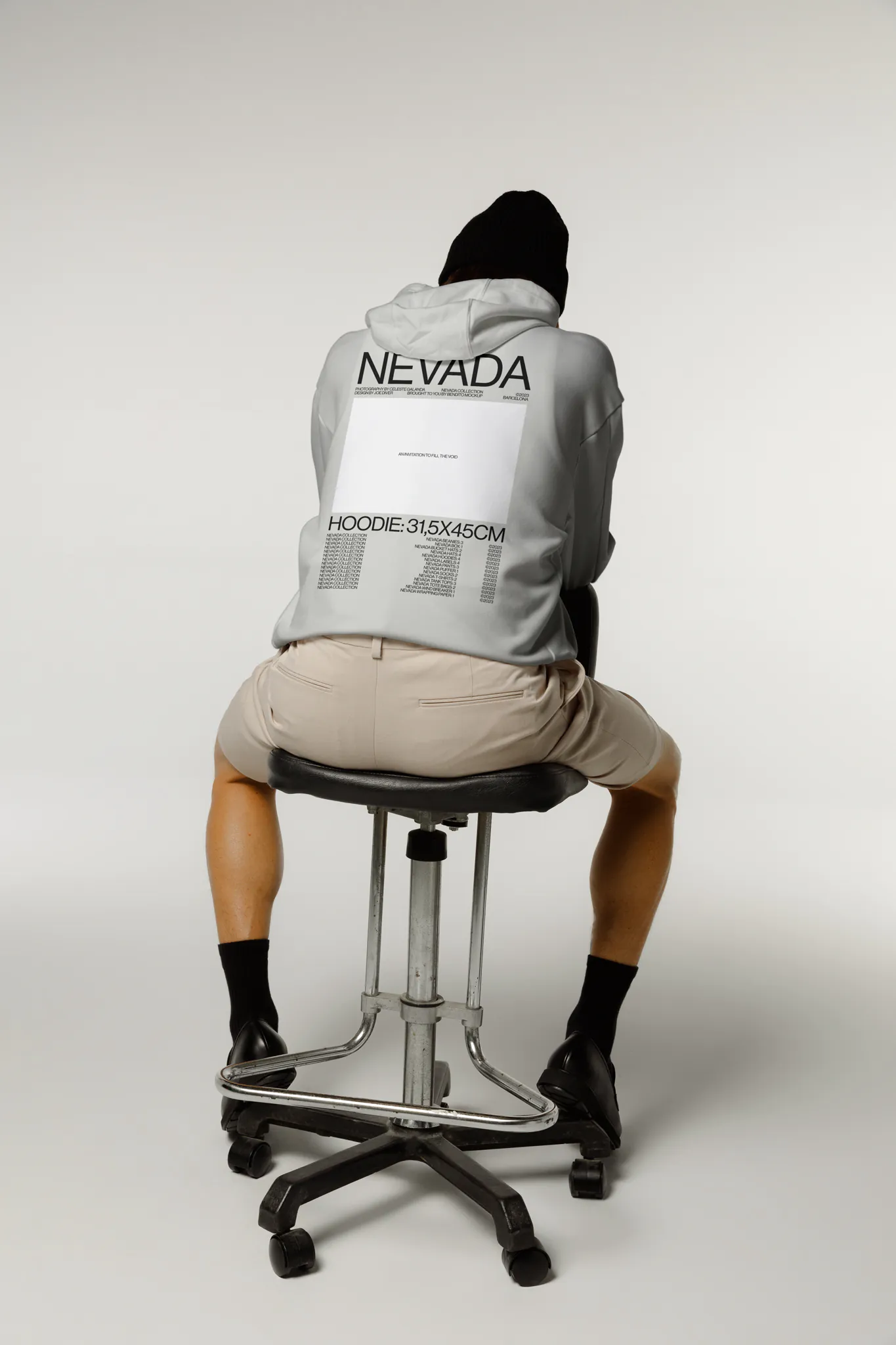Male sitting on a chair wearing a hoodie mockup, PSD file of a man wearing a hoodie mockup, fashion mockup, hoodie mockup, clothing mockup.