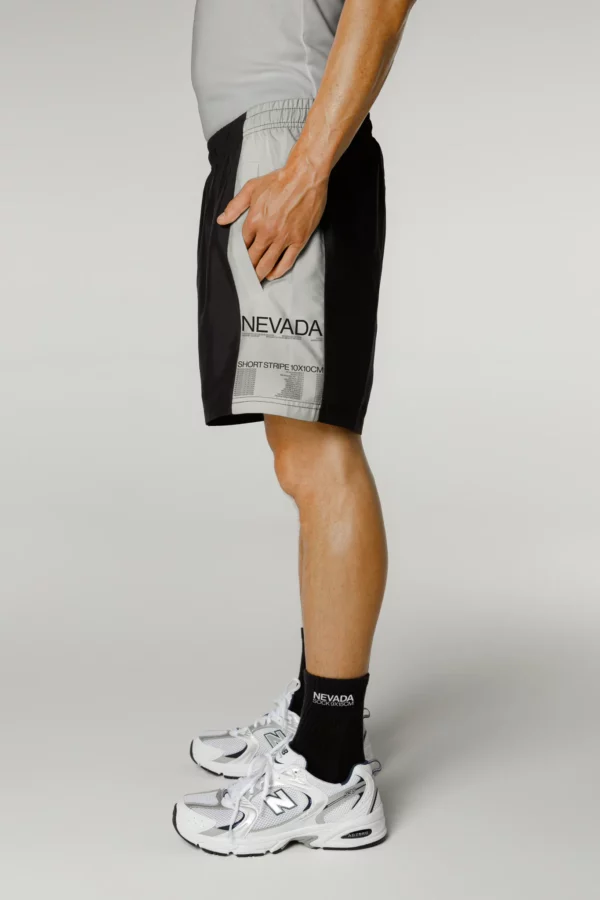 Guy wearing a short pants mockup and black socks mockup, short pants mockup, socks mockup, fashion mockup, apparel mockup, high quality fashion mockup.