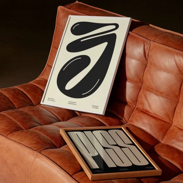 two posters mockups on a brown couch