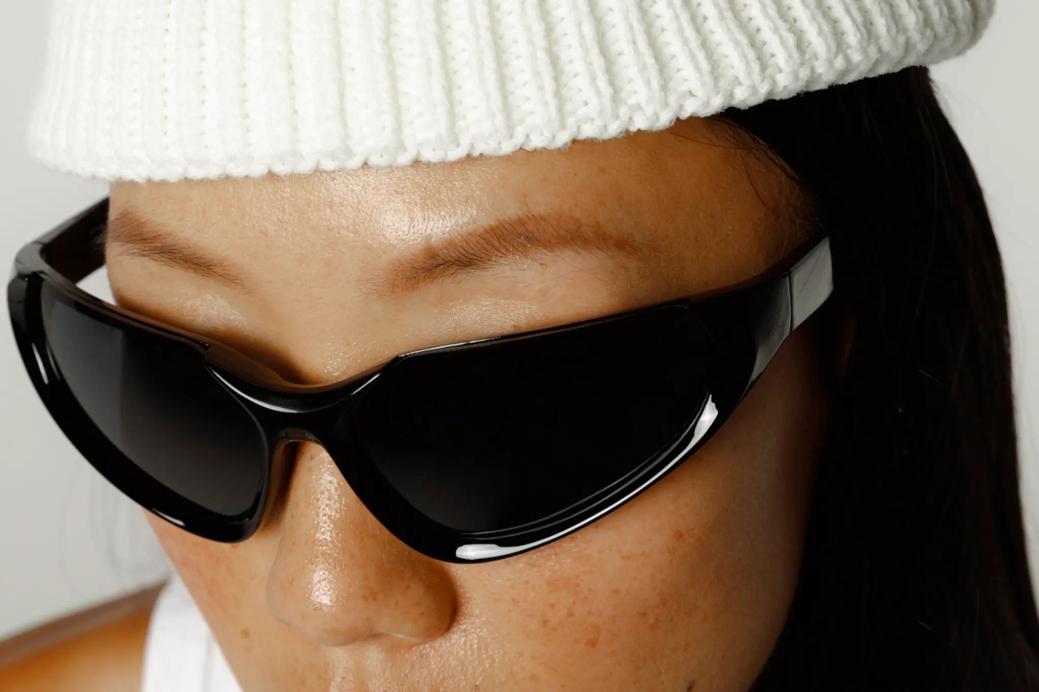 girl wearing sunglasses and a white beanie mockup