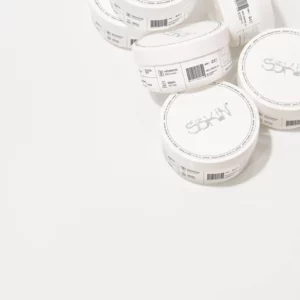 Pile of cosmetic jars mockup on a white surface. Cream Jar mockup. Packaging mockup. Cream jar PSD file. High-quality packaging mockup.