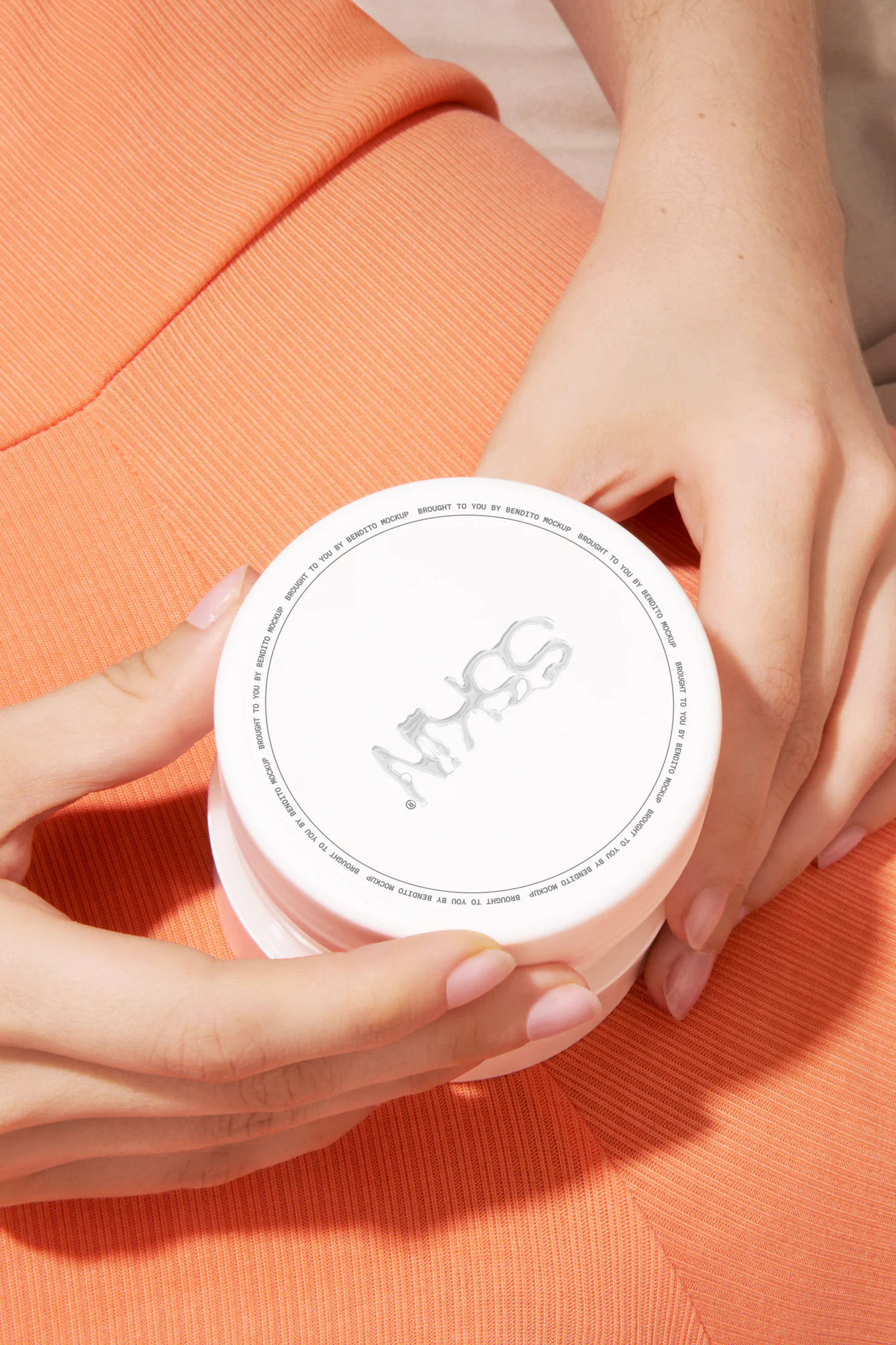 Woman with an orange dress holding a cosmetic jar mockup. Packaging PSD file. Cream jar mockup. Skin care mockup.