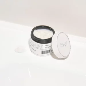 Cream jar mockup on a white bathroom sink. Cream jar PSD file. Packaging mockup. Cream jar mockup. Premium quality skin care mockup.
