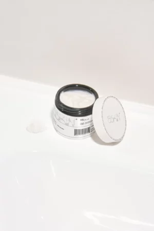 Cream jar mockup on a white bathroom sink. Cream jar PSD file. Packaging mockup. Cream jar mockup. Premium quality skin care mockup.